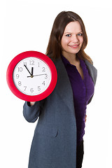 Image showing Woman holding a clock