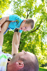 Image showing happy father and son have fun at park