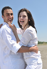 Image showing happy young couple have fun on beach