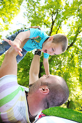 Image showing happy father and son have fun at park