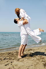 Image showing happy young couple have fun on beach