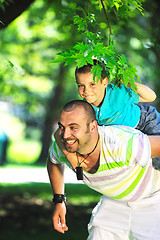 Image showing happy father and son have fun at park