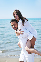 Image showing happy young couple have fun on beach