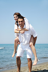 Image showing happy young couple have fun on beach