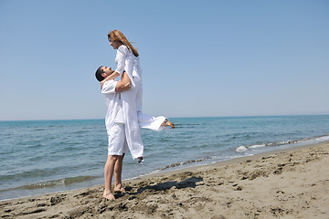 Image showing happy young couple have fun on beach