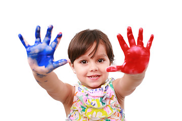 Image showing beautiful little girl with her hands in the paint 
