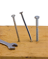 Image showing nails hammered board bend screw bolt wrench white 