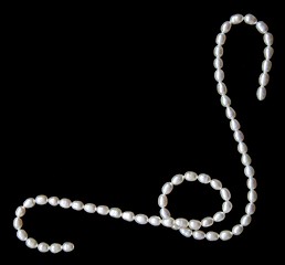 Image showing White pearls on the black velvet background 