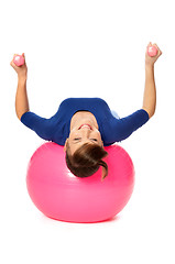 Image showing Exercises with dumbbells on a gymnastic ball