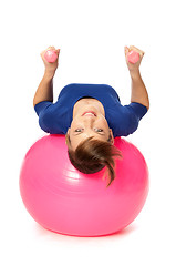 Image showing Exercises with dumbbells on a gymnastic ball