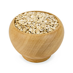 Image showing Oat flakes in a wooden bowl