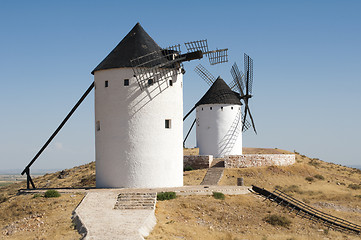 Image showing White ancient windmills