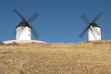 Image showing White ancient windmills