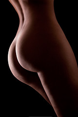 Image showing Beautiful ass of young woman over dark background