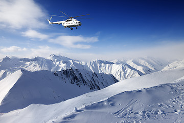 Image showing Heliski in snowy mountains