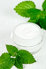 Image showing face cream in jar with urtica 