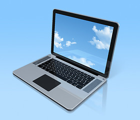 Image showing Laptop computer isolated on blue with sky screen