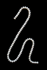 Image showing White pearls on a black velvet 