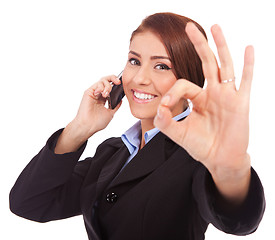 Image showing business woman with phone and ok gesture