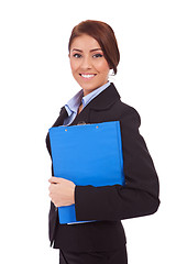 Image showing Portrait of a business woman holding a clipboard