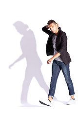 Image showing fashionable man walking and looking at the camera