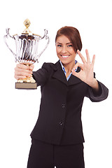 Image showing business woman with trophy make ok gesture