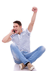 Image showing casual man winning on the phone