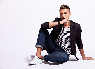 Image showing cool fashion male model sitting