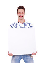 Image showing casual man holding white sign to write it on your text