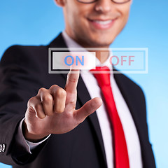 Image showing business man pushing On button