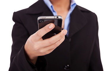 Image showing business woman texting on a smartphone