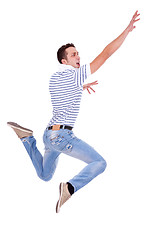 Image showing jumping young casual man