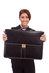 Image showing  business woman handing a suit case to you