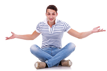 Image showing man seated on studio, welcoming