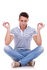 Image showing young handsome man meditating