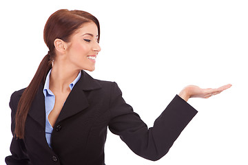 Image showing Business woman presenting something