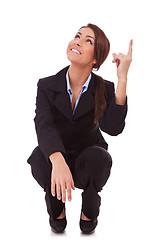 Image showing  business woman standing down and pointing up