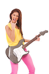 Image showing passionate young woman guitarist playing