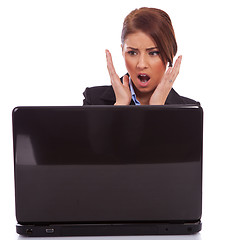 Image showing business woman reading bad news at laptop