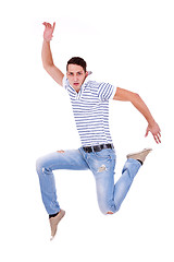 Image showing casual man jumping of joy 