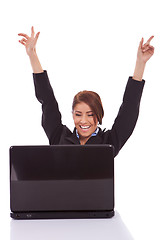 Image showing  business woman in office jubilates at desk