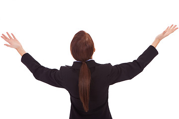 Image showing back of a business woman holding her hands up