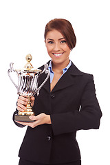 Image showing young business woman holding her big trophy 