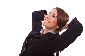 Image showing side view of a relaxed business woman