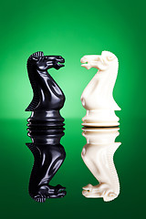 Image showing white and black knights facing aeach other