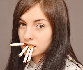 Image showing woman with cigarettes