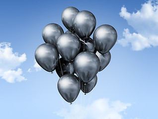 Image showing silver balloons on a blue sky
