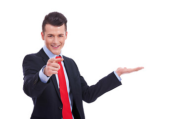 Image showing business man showing and pointing 