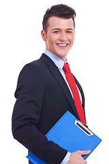 Image showing businessman holding blank clipboard