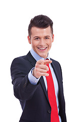 Image showing young business man pointing at you 